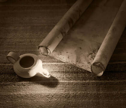 Old oil lamp and scroll