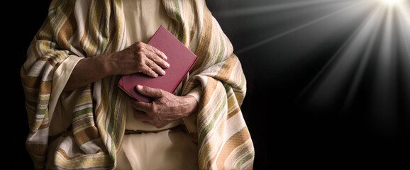 Old man holding a book