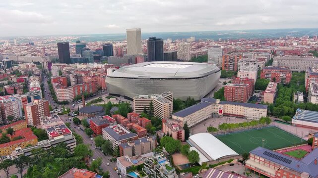 MADRID,SPAIN: Aerial view of the iconic Bernab&eacute;u football stadium, home of Real Madrid with its striking modern exterior, ideal for travel, sports or city footage.