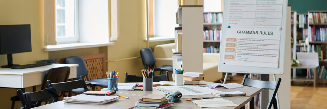 Empty classroom with desks and educational equipment in a library setting