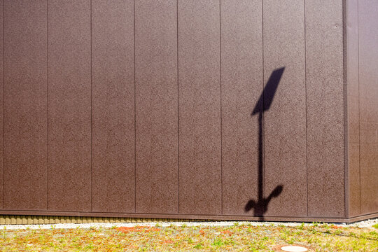 Surveillance camera shadows on house wall outdoors in Augsburg