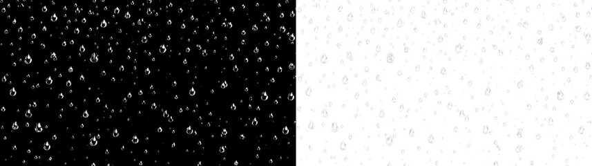 Water droplets fall on a clear surface creating a pattern of various shapes and sizes in a simple setting © tanandaa