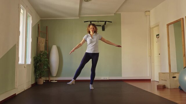 Woman improving balance with stability training workout