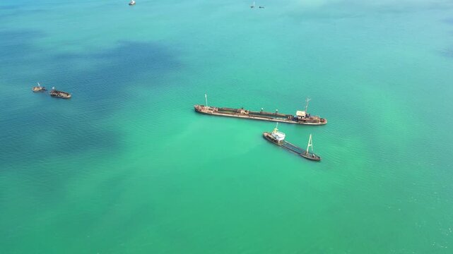 Circular aerial view over Ana Chaves Bay with several sunken boats.S&atilde;o Tom&eacute;,Africa
