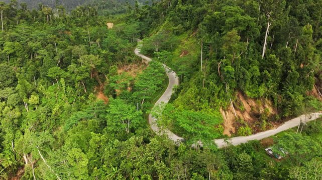 Aerial travel scene over tropical mountain road after typhoon in Palawan