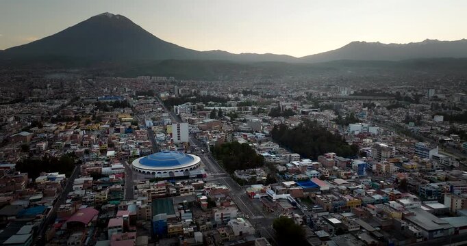 Cityscape of Arequipa, the white city, with the iconic Misti volcano in the background at sunrise, Peru. Aerial drone