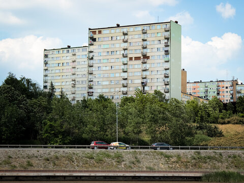 Polish communist-era apartment blocks near forested lake in Gniezno