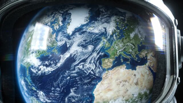 Astronaut helmet visor rim reflecting Earth showing continents, clouds and flare shifting in space
