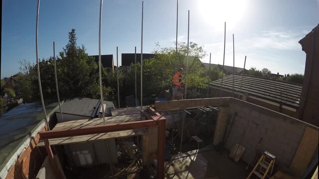 Time lapse of scaffold being erected for a house extension. 