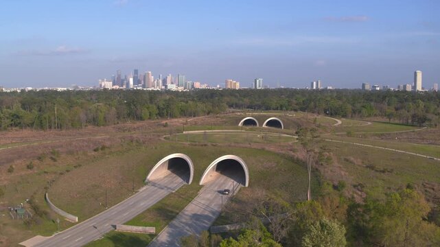 Wide angle drone shot of Houston green space park and downtown Houston in the background