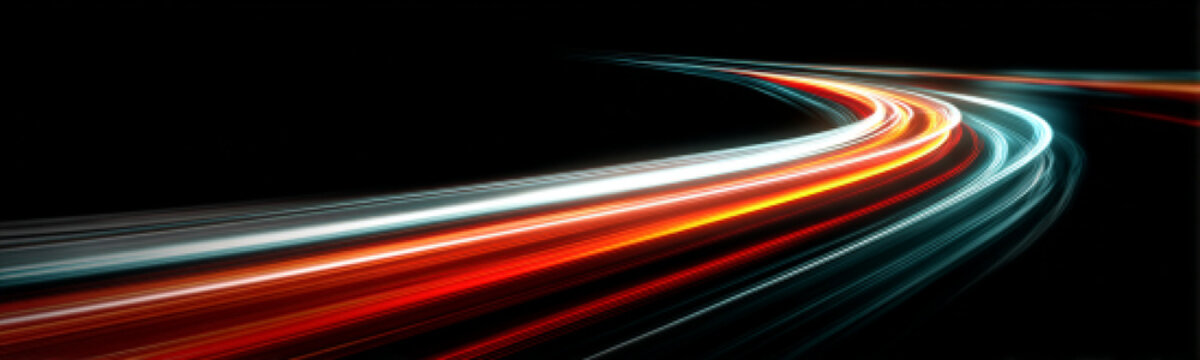 Orange neon arcs twist dynamically along city streets. Motion blur emphasizes speed and energy. Futuristic visuals dominate the scene.
