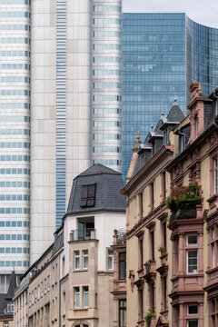 Architecture contrast in Frankfurt Bankenviertel Germany where historic facade street perspective points to modern skyscraper skyline
