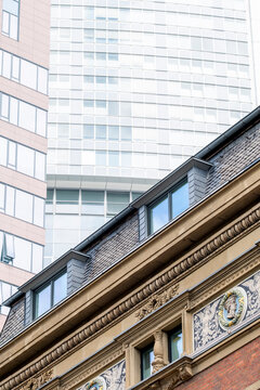 Architecture contrast in Frankfurt Bankenviertel Germany as historic facade cornice aligns with a modern skyscraper skyline of glass