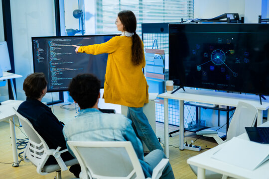 Diverse creative team of programmer develop ai assistant project together.Software engineer brainstorm about brain android robot,coding language,designer,artificial virtual intelligence with big data