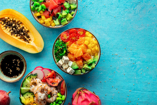 Poke bowl assortment. Rice with salmon, shrimps, and grapefruit