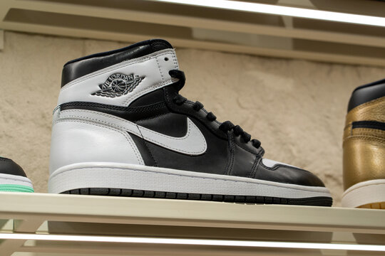 Nike Air Jordan stylish sneakers on display shelf at Nike brand store. Nike Air Jordan 1 black and white color. Minsk, Belarus - December 16, 2025