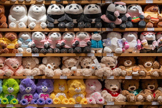 Plush toys for kids on the shelves in Miniso Brand Store. A bright display case with children's toys in a store. Minsk, Belarus - December 16, 2025