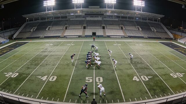 Athletes carry out strategic moves under vivid stadium illumination
