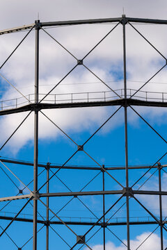 Minimalism in architecture with steel structure lattice framework geometry pattern lines and open sky clouds creating clean abstract background