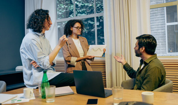 software developers conducting joint code review while planning upcoming features and improvements