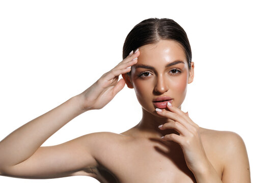 Beautiful young woman with clean fresh skin on white background.