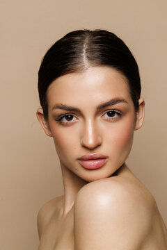 Portrait of young woman on beige background, space for text. Spa treatment