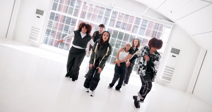 Art, hip hop and music with people in dance studio for choreography, rehearsal or training together. Creative, energy and movement with dancer group in class for learning, lesson or practice routine