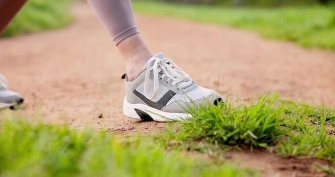 Hands, outdoor and woman with shoelace for fitness, running and walking for health. Female person, closeup and preparing in training shoes with jogging, exercise and workout for wellness or self care