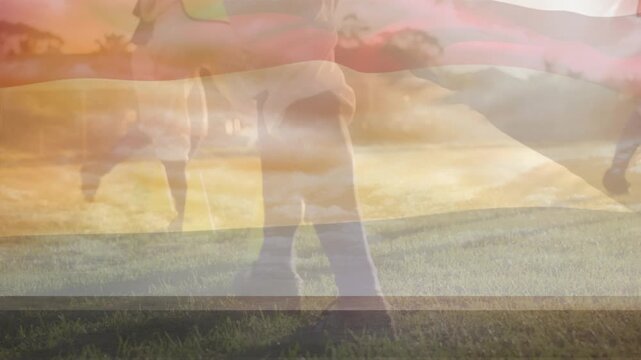 Animation of flag of united states of america over children and football players