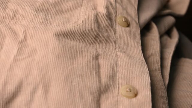 Rotating Cream Color Denim Jeans Shirt Fabric Texture &ndash; Close Up Side View
