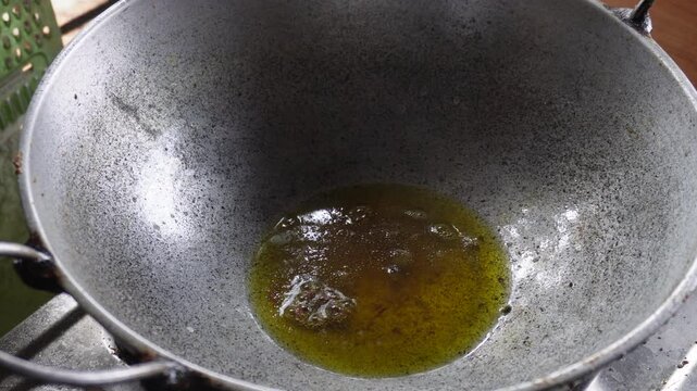 Hot oil in frying pan cooking heat and kitchen preparation concept