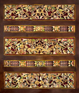Close up rustic vintage wood panel carved with random pattern, in brown old wood and gold metalic paint color. Ethnic traditional engraving. Seamless background texture.