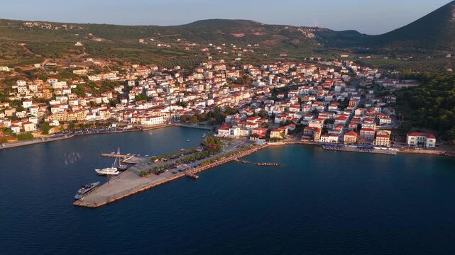 Panoramic aerial view of the town of Pylos, Navarino Coast, Peloponnese, Greece, with harbour and old castle during summer sunset time