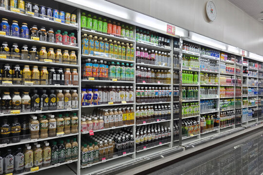 Oita, Japan - Jan 07, 2026: Neatly organized rows of bottled water, soft drinks, energy drinks, and tea displayed in large refrigerated walk-in coolers at a 7-Eleven in Oita.