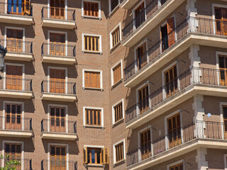 Obraz premium Residential apartment facade with balconies and windows in Valencia Spain