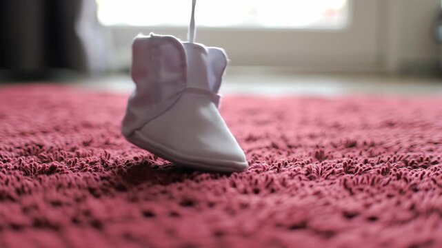 One person in slipper jumping on a red soft rug. Home and indoor concept.