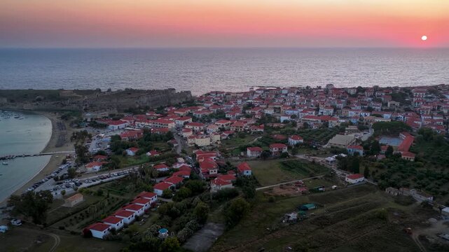 Aerial sunset view of the village of Methoni, Messinia, Greece, with the ancient castle and beach waterfront