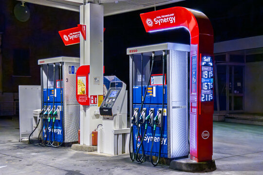 Italy &ndash; March 22, 2026: An Esso-branded gas station featuring the Synergy fuel design and technology. Self-service pumps with automatic payment terminals t. Fuel price increase concept