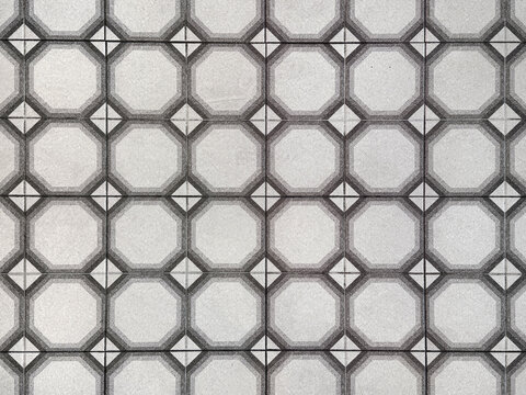 Colonial heritage patterned tiles in random geometrical grid and diamond pattern. Handmade colonial tiles, or old heritage tiles in monochrome black and white paint colors. Seamless texture.