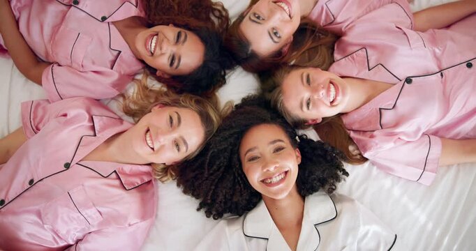 Friends, people and face by above for bridal shower, celebration and smile in hotel bedroom. Group, women and bride in portrait for embrace, solidarity and sisterhood in bachelorette party by top