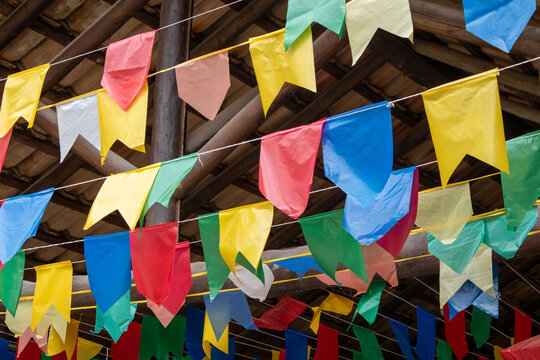 Colorful little flags from the Brazilian Festa Junina, traditional decorations for the June folklore festival, for the Saint John's Day celebrations.