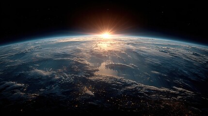 Fototapeta premium Sunrise over Earth from space with glowing atmosphere and city lights planet