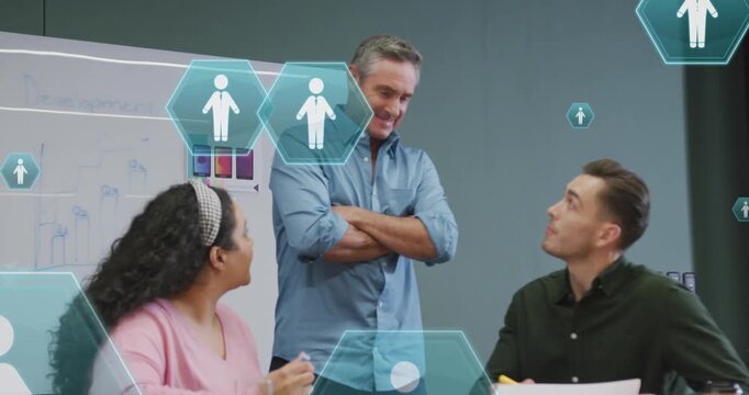 Animation of profile icons floating against diverse colleagues discussing together at office