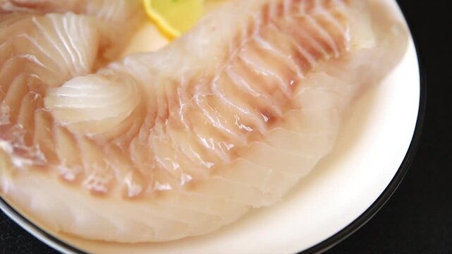 Cod fish fillet, raw fish seafood tasty snack fresh pescetarian diet gourmet food background on the table pescetarian diet rustic food top view copy space keto and paleo diets 