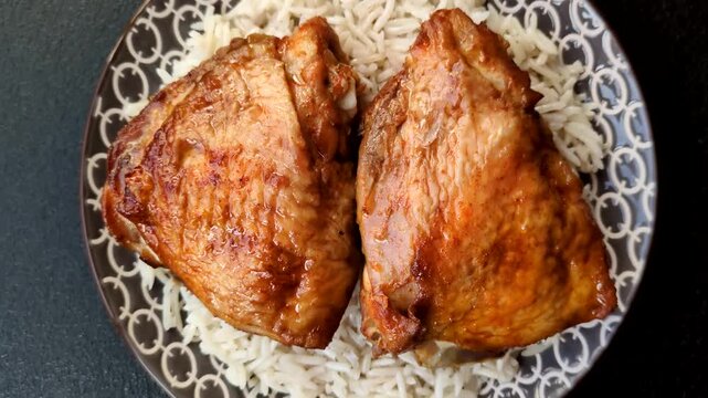 Kabsa or haneeth, an Arabic dish with rice and chicken, salt, and spices. Kabsa or haneeth as a food background for your design