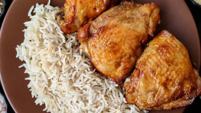 Kabsa or haneeth, an Arabic dish with rice and chicken, salt, and spices. Kabsa or haneeth as a food background for your design