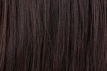 Naklejka premium Long straight dark hair texture background