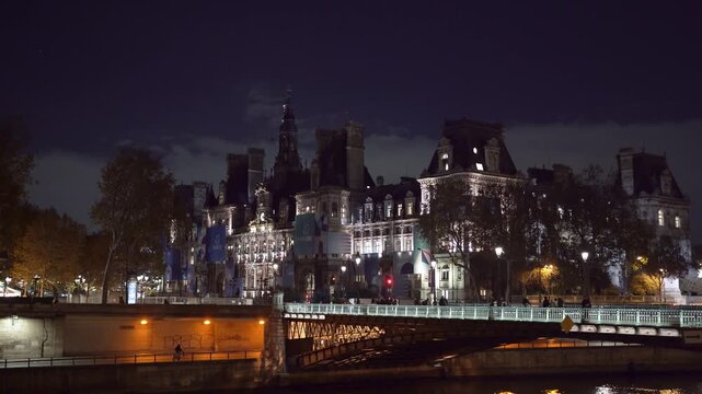 Paris H&ocirc;tel de Ville in France at night with river