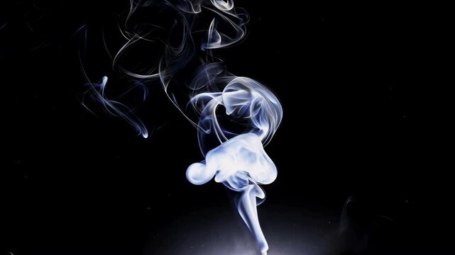 Ephemeral Elegance: Delicate strands of smoke dance against a stark backdrop, capturing the fluid beauty and transient nature of this ethereal phenomenon.