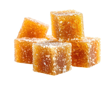 Amber-colored, sugar-dusted cubes piled together on a white background